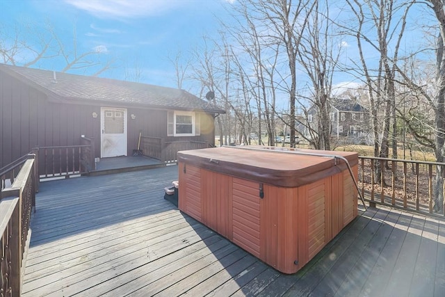 wooden terrace with a hot tub