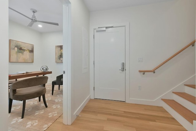 entryway with hardwood / wood-style floors and ceiling fan