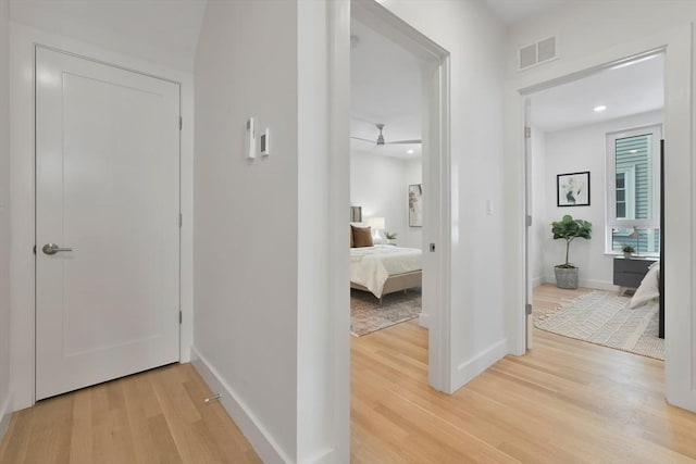 corridor featuring wood-type flooring