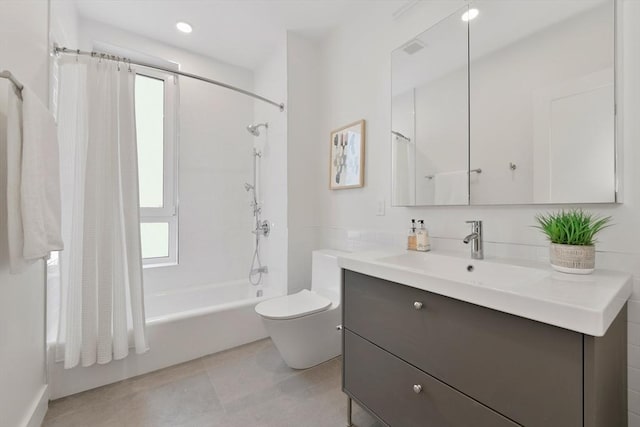 full bathroom featuring vanity, toilet, tile patterned flooring, and shower / bath combo