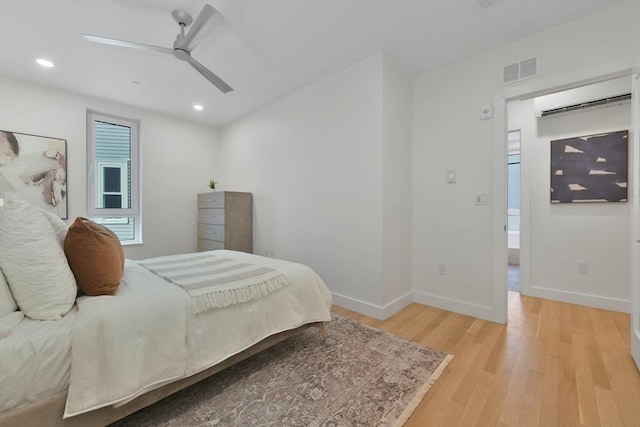 bedroom featuring ceiling fan and light wood-type flooring