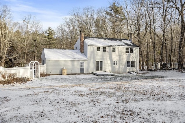 snow covered property featuring a wooden deck