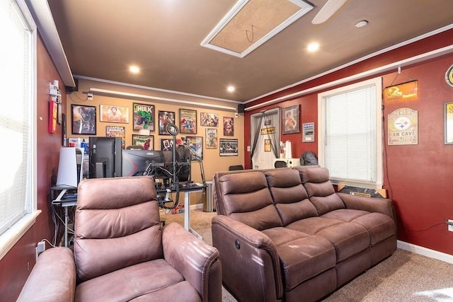 carpeted cinema room with ornamental molding