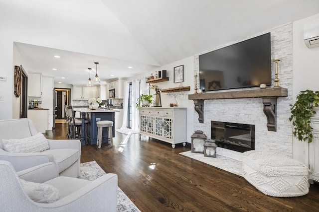 living room featuring a wall mounted air conditioner, dark hardwood / wood-style flooring, high vaulted ceiling, and a stone fireplace