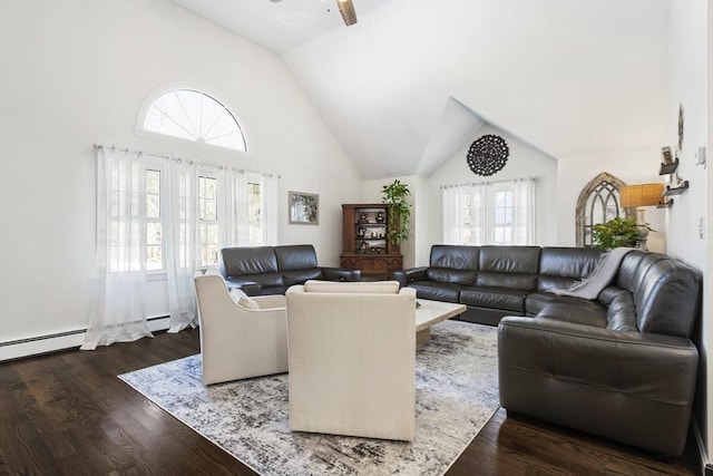 living room featuring dark hardwood / wood-style flooring, high vaulted ceiling, and ceiling fan