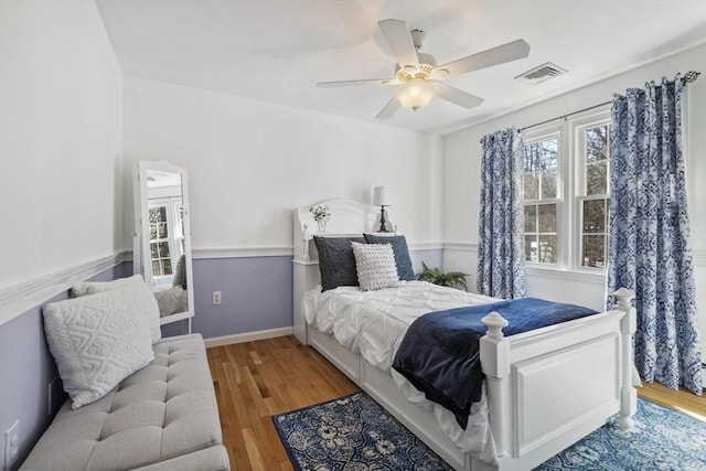 bedroom featuring hardwood / wood-style flooring and ceiling fan