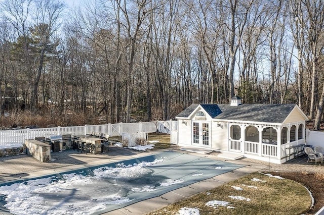 view of swimming pool featuring an outdoor structure and a patio area