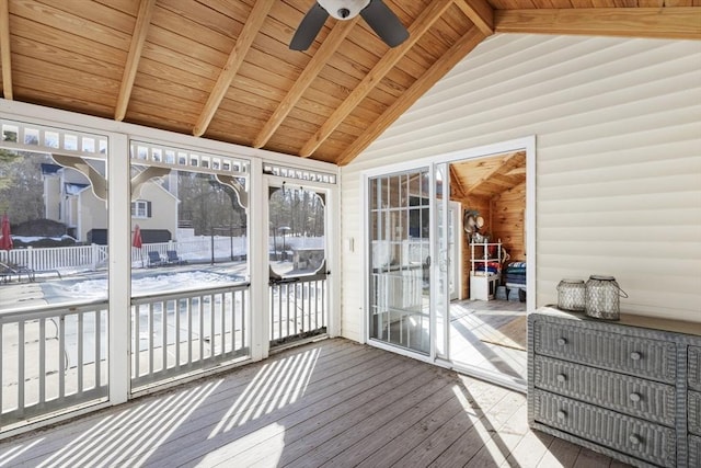 sunroom / solarium featuring lofted ceiling with beams, wooden ceiling, and ceiling fan