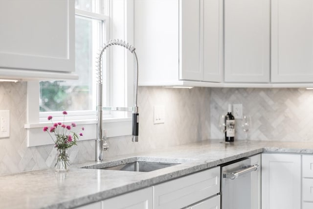 24 Valley Rd, Yarmouth, MA 02673 - kitchen with tasteful backsplash, a sink, light stone countertops, and white cabinets