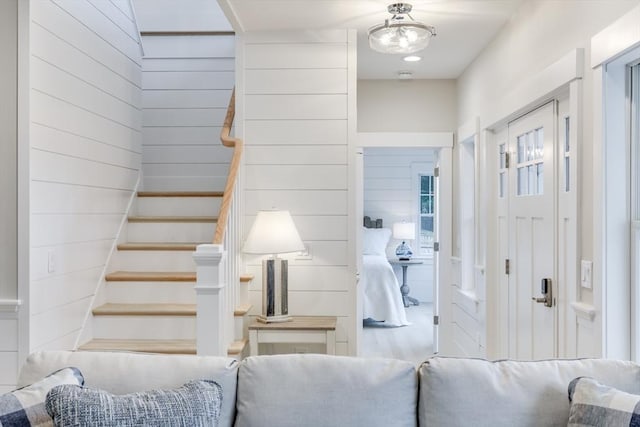 24 Valley Rd, Yarmouth, MA 02673 - foyer entrance with wooden walls and stairs