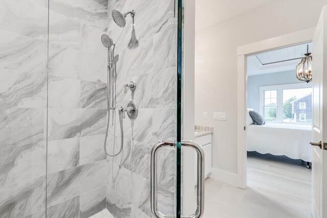 24 Valley Rd, Yarmouth, MA 02673 - bathroom with a chandelier, baseboards, ensuite bath, and a shower stall