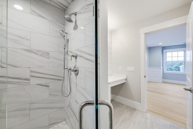 24 Valley Rd, Yarmouth, MA 02673 - full bathroom featuring a stall shower, baseboards, and wood finished floors