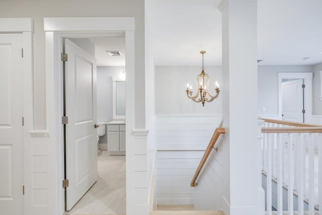 24 Valley Rd, Yarmouth, MA 02673 - hall featuring visible vents, a chandelier, and an upstairs landing