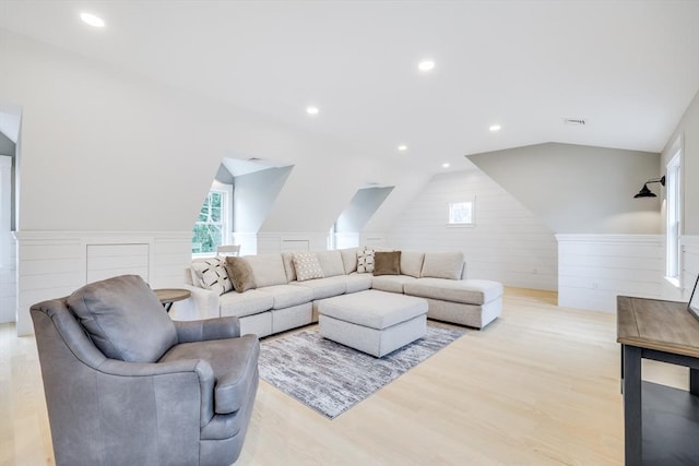 24 Valley Rd, Yarmouth, MA 02673 - living room featuring vaulted ceiling, recessed lighting, light wood-type flooring, and plenty of natural light