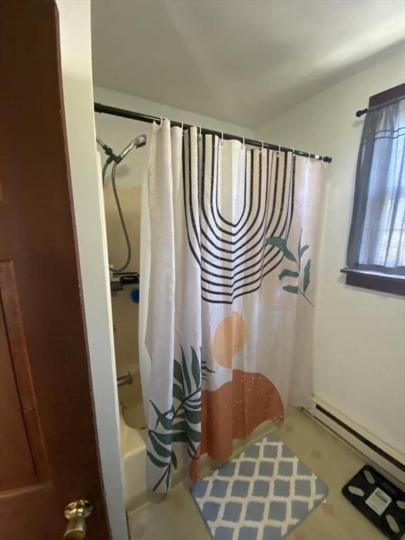 bathroom featuring a baseboard radiator and shower / bath combo with shower curtain