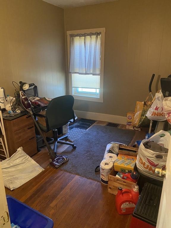 home office with wood finished floors and baseboards