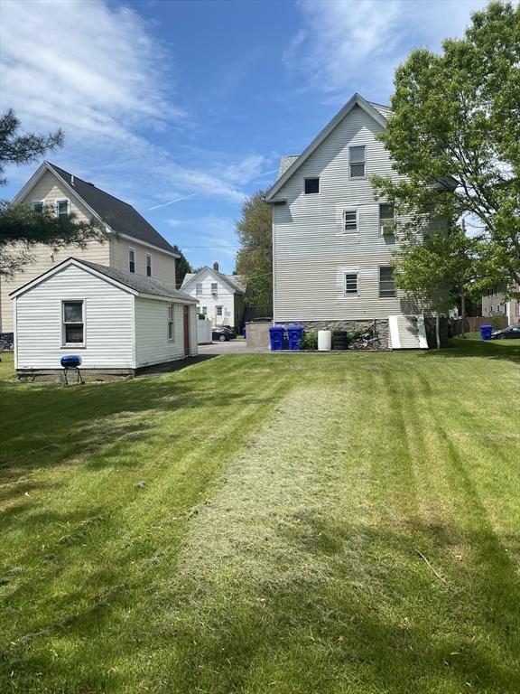 view of home's exterior with a yard