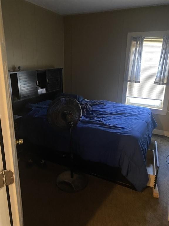 bedroom with carpet and baseboards