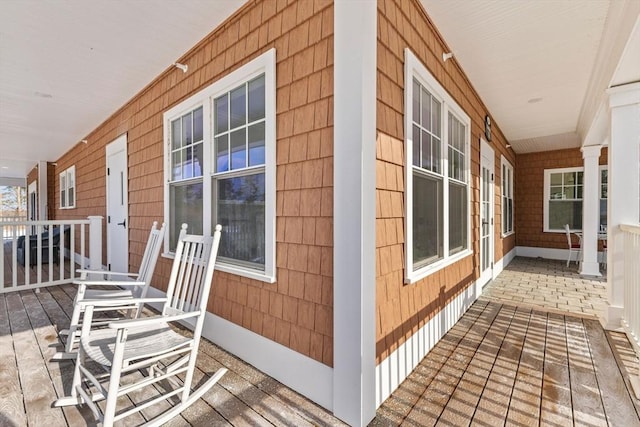 view of side of home with a porch