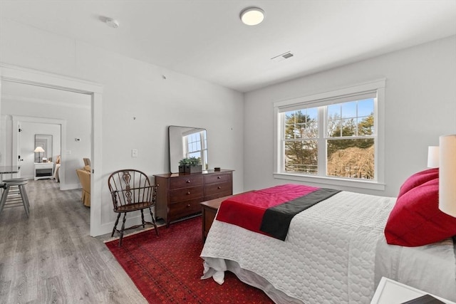 bedroom with light hardwood / wood-style floors