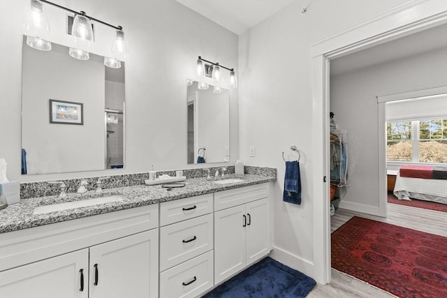 bathroom featuring vanity and hardwood / wood-style floors