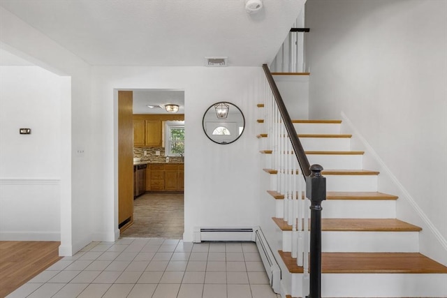 stairs with tile patterned flooring