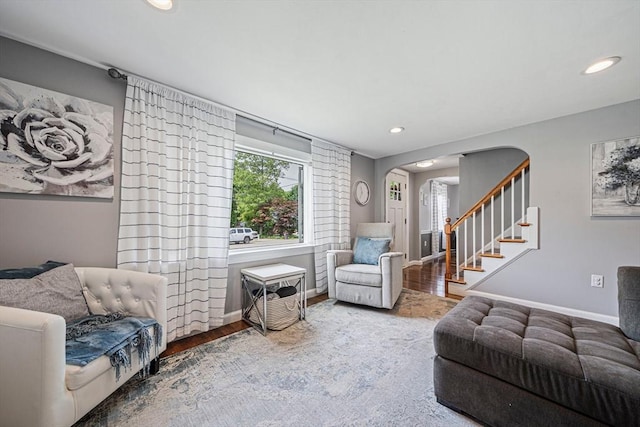 864 Front St, Weymouth, MA 02190 - living area with wood finished floors, arched walkways, baseboards, recessed lighting, and stairs