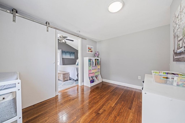 864 Front St, Weymouth, MA 02190 - kitchen with wood finished floors, a barn door, a ceiling fan, and baseboards