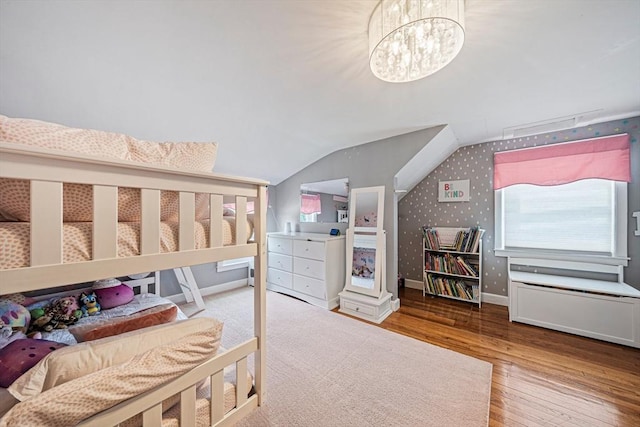 864 Front St, Weymouth, MA 02190 - bedroom with wood finished floors, baseboards, lofted ceiling, and a chandelier