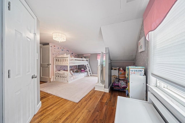 864 Front St, Weymouth, MA 02190 - bedroom with wood finished floors, wallpapered walls, and vaulted ceiling
