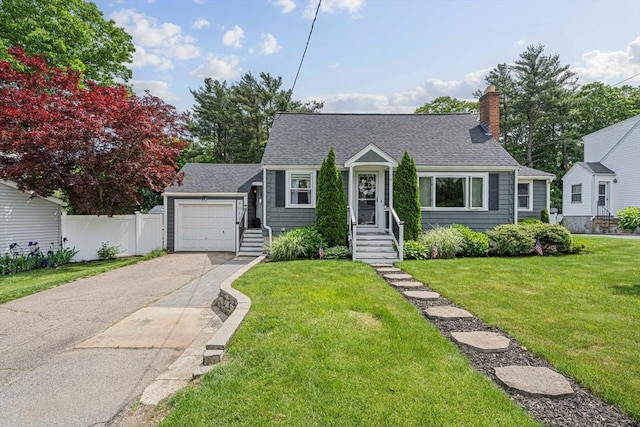864 Front St, Weymouth, MA 02190 - view of front facade with asphalt driveway, a shingled roof, and a chimney