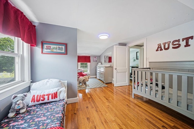 864 Front St, Weymouth, MA 02190 - bedroom featuring wood finished floors, vaulted ceiling, and baseboards