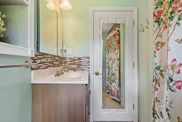 bathroom featuring decorative backsplash and vanity