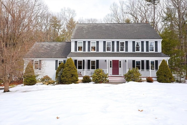 view of front of property featuring a porch and a shingled roof