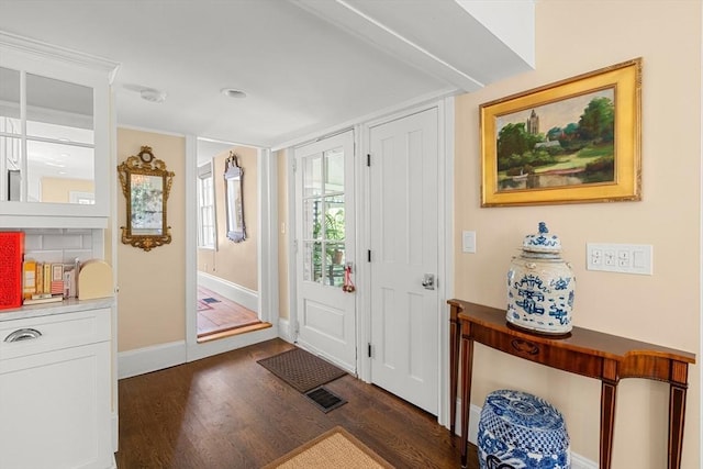 163/165 Highland St, Dedham, MA 02026 - foyer entrance with wood finished floors and baseboards