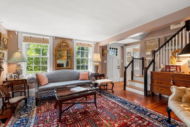 163/165 Highland St, Dedham, MA 02026 - living area with wood finished floors, stairs, and plenty of natural light