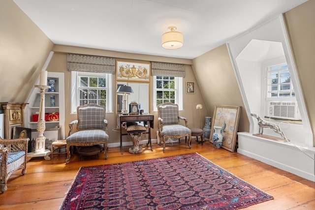 163/165 Highland St, Dedham, MA 02026 - sitting room with wood-type flooring, cooling unit, and vaulted ceiling
