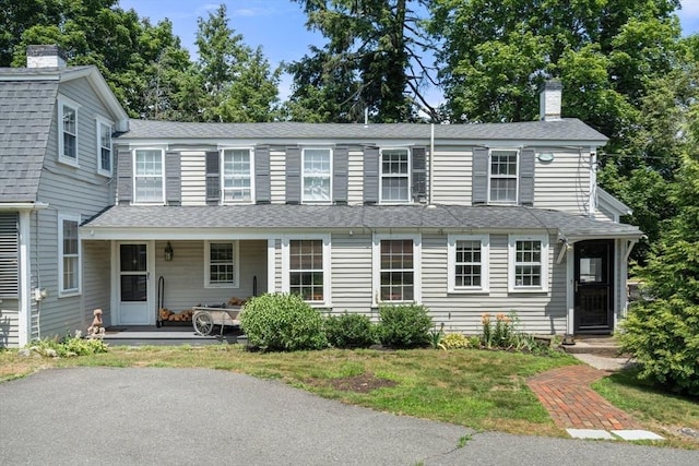 163/165 Highland St, Dedham, MA 02026 - view of front of house with a chimney, roof with shingles, and a porch