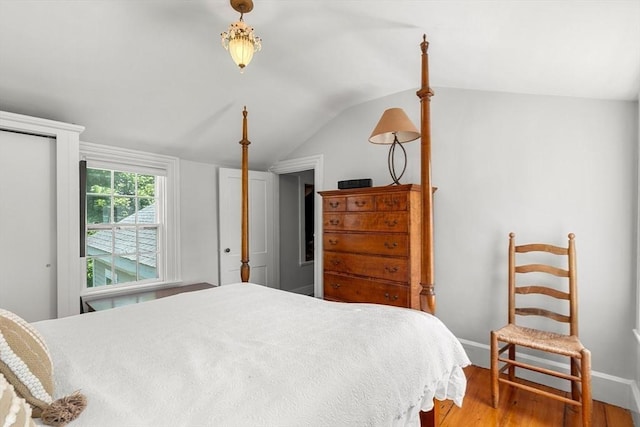 163/165 Highland St, Dedham, MA 02026 - bedroom featuring lofted ceiling and wood finished floors