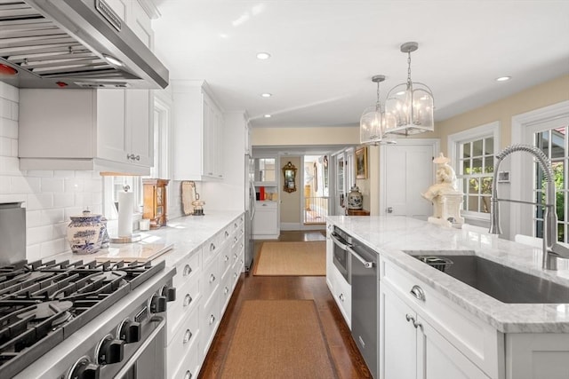 163/165 Highland St, Dedham, MA 02026 - kitchen with ventilation hood, stainless steel appliances, dark wood-type flooring, white cabinetry, and recessed lighting
