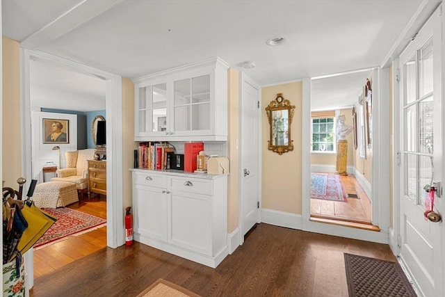163/165 Highland St, Dedham, MA 02026 - bar with dark wood finished floors and baseboards