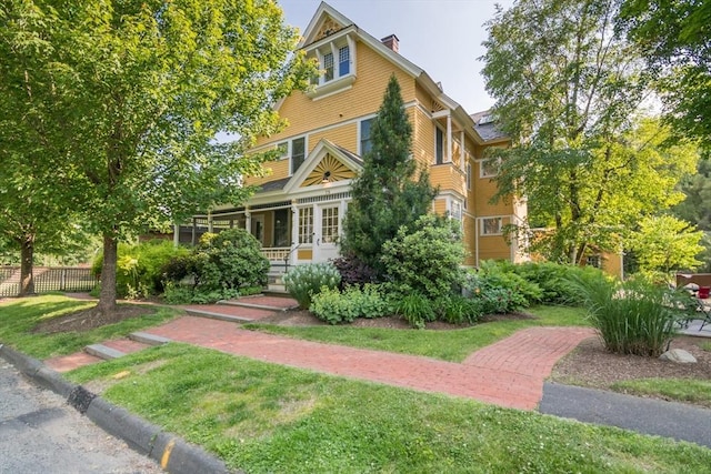 75 Lyman Rd, Northampton, MA 01060 - view of front of property with covered porch and a chimney