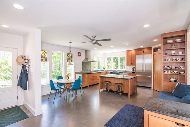 75 Lyman Rd, Northampton, MA 01060 - kitchen featuring stainless steel built in refrigerator, wall chimney exhaust hood, healthy amount of natural light, recessed lighting, and concrete floors