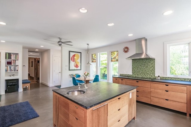 75 Lyman Rd, Northampton, MA 01060 - kitchen featuring wall chimney range hood, a sink, finished concrete floors, recessed lighting, and a center island with sink