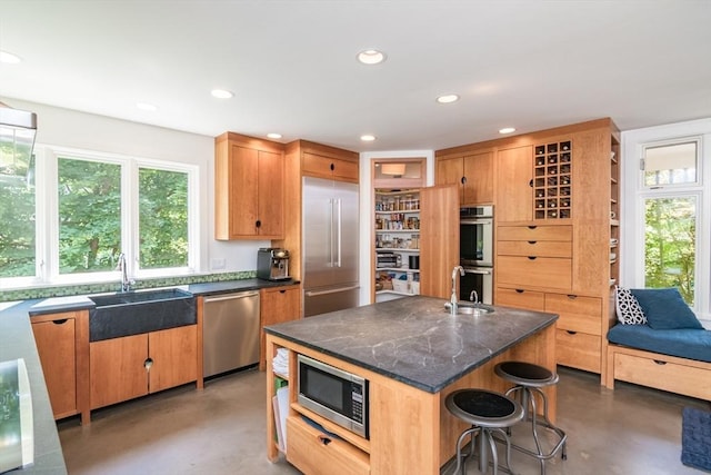 75 Lyman Rd, Northampton, MA 01060 - kitchen featuring stainless steel appliances, a sink, finished concrete floors, and recessed lighting