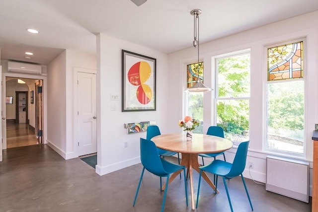 75 Lyman Rd, Northampton, MA 01060 - dining space featuring baseboards, finished concrete flooring, a wall unit AC, recessed lighting, and radiator