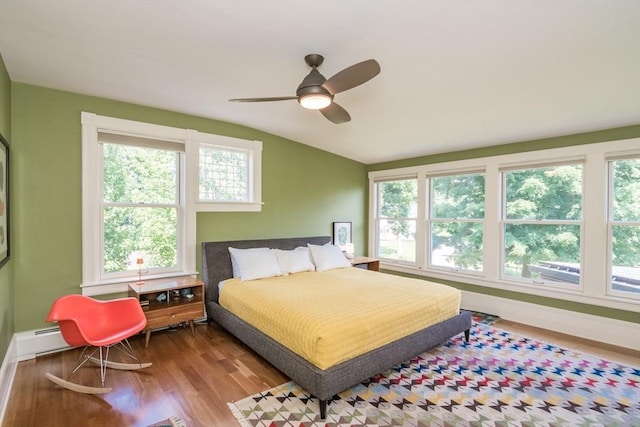75 Lyman Rd, Northampton, MA 01060 - bedroom with multiple windows, lofted ceiling, wood finished floors, baseboards, and ceiling fan