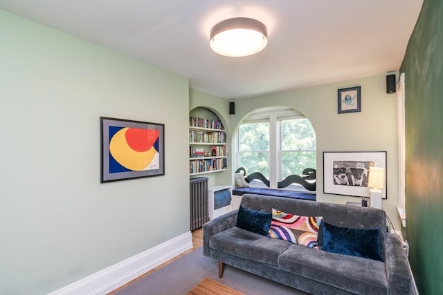 75 Lyman Rd, Northampton, MA 01060 - living area with built in shelves, baseboards, and wood finished floors