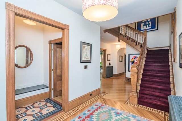 75 Lyman Rd, Northampton, MA 01060 - hallway with arched walkways, stairs, and baseboards