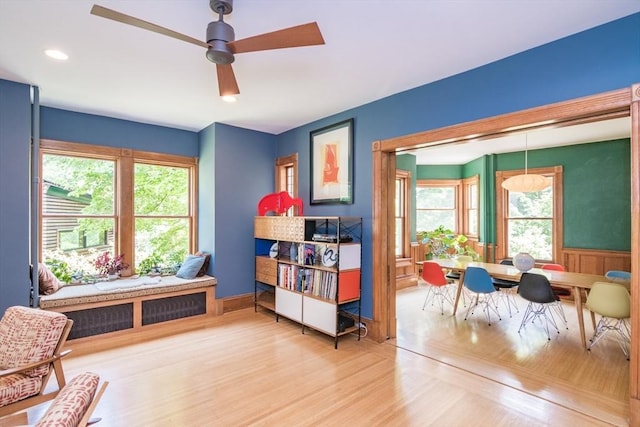 75 Lyman Rd, Northampton, MA 01060 - sitting room featuring a ceiling fan, plenty of natural light, wood finished floors, and wainscoting